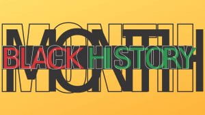 Black History Month in red, green and black on a yellow background